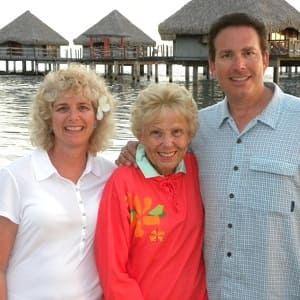 cruise passengers in front of Tahiti bungalow