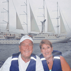 guest in front of cruise ship